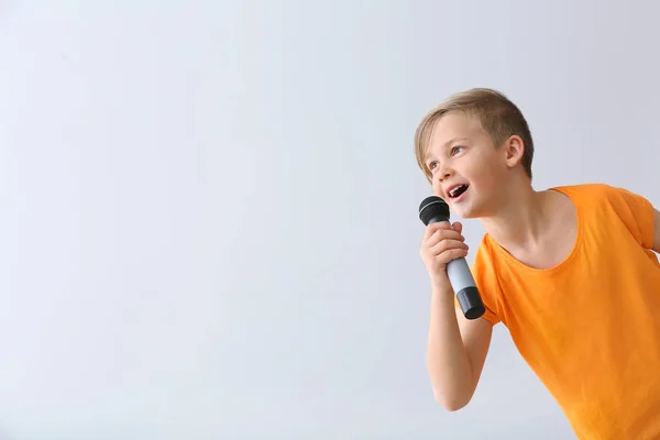 children talking in microphone